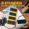Acht zonnepanelen liggen op een bruine deken op een houten vloer, naast een smartphone en een USB-kabel