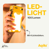 Hand die een geel LED-zaklampje vasthoudt dat brandt tegen een witte achtergrond, naast oranje en zwarte tekst met de woorden ‚LED-licht 100 lumen met 4 lichtsterktes.‘
