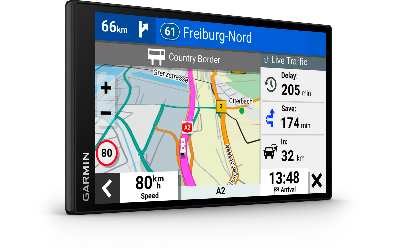 Schwarzes Garmin-Navigationsgerät mit Bildschirm, Straßenkarte, pink markierte Route, Kennzeichnung 'A2', Text 'Country Border' auf der Karte, Tempolimit-Schild '80', Anzeige '80 km/h', obere Leiste '66 km' und '61 Freiburg-Nord', rechter Bereich 'Li