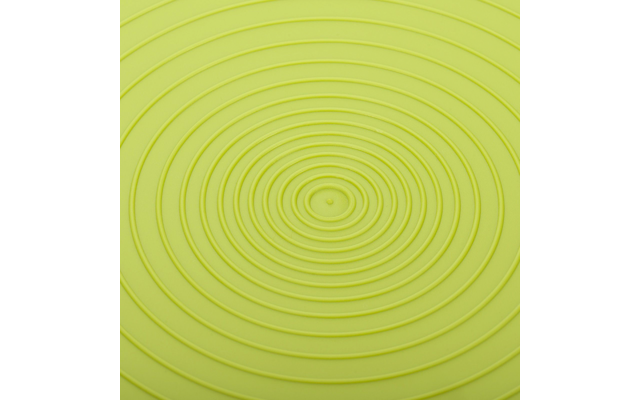 Gros plan d'une surface vert clair avec des anneaux concentriques
