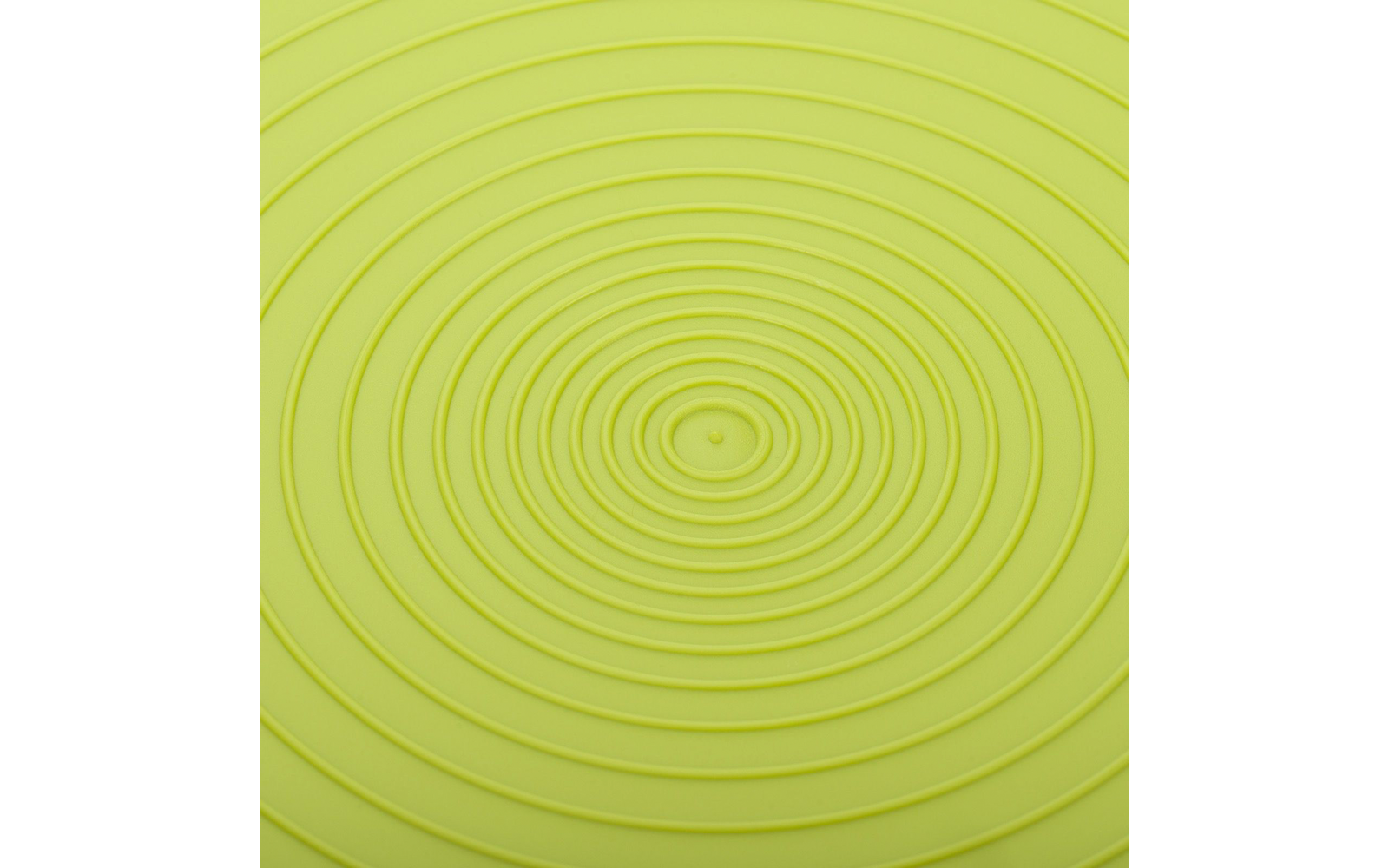 Gros plan d'une surface vert clair avec des anneaux concentriques