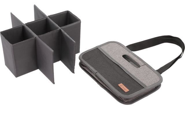 Ein graues Ladegerät mit USB-Anschluss und vier Steckplätzen