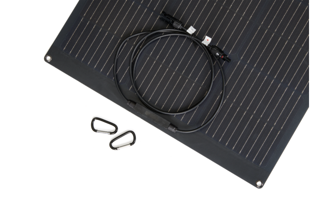 Black rectangular solar panel with coiled cable and two black carabiner clips on a white background