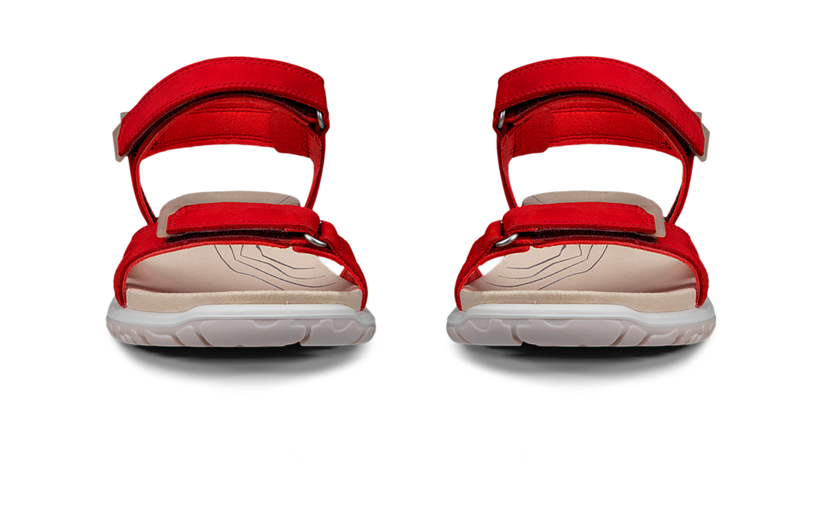 Twee rode sandalen met klittenbandsluitingen, witte zolen en beige binnenzolen, vooraanzicht op witte achtergrond