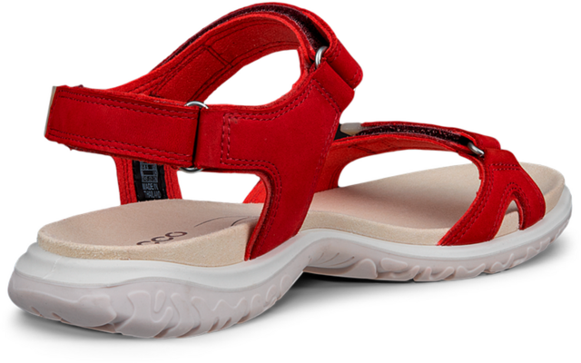 Rode sandaal met klittenbandsluitingen, lichtbeige gevoerd voetbed en witte loopzool met profiel, zijaanzicht op witte achtergrond