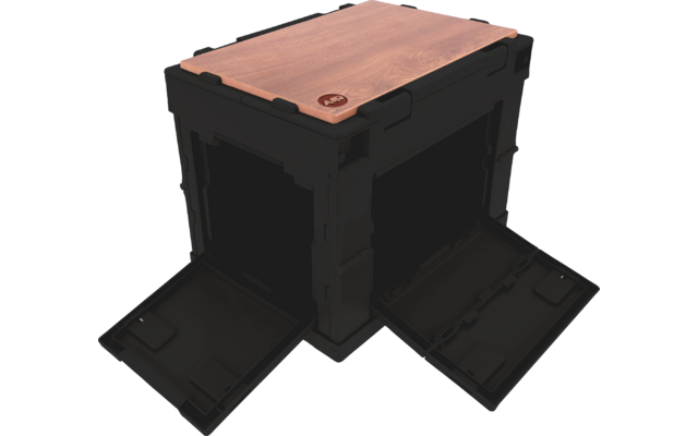 Black square plastic crate with two open flap doors on two adjacent sides, wooden top panel and small round emblem on the front corner