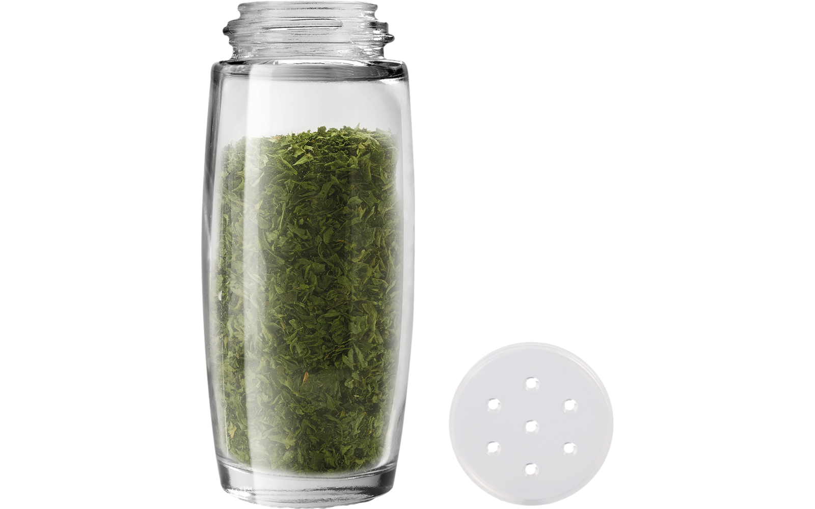 Transparante kruidenpot met groen gedroogd kruid, deksel naast de pot
