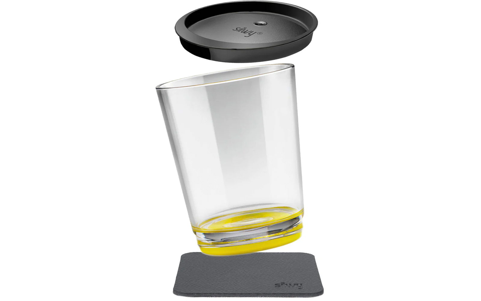 Clear drinking glass tilted, yellow ring at the base, black silicone lid above, square dark coaster below