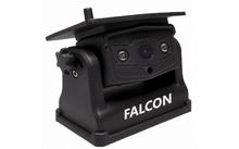 Schwarzes rechteckiges Gerät mit zentraler Linse, zwei kleinen LEDs, klappbarem Sonnenschutz und weißem Schriftzug 'FALCON' auf der Basis