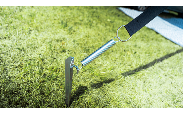 Metal stake driven into dry soil