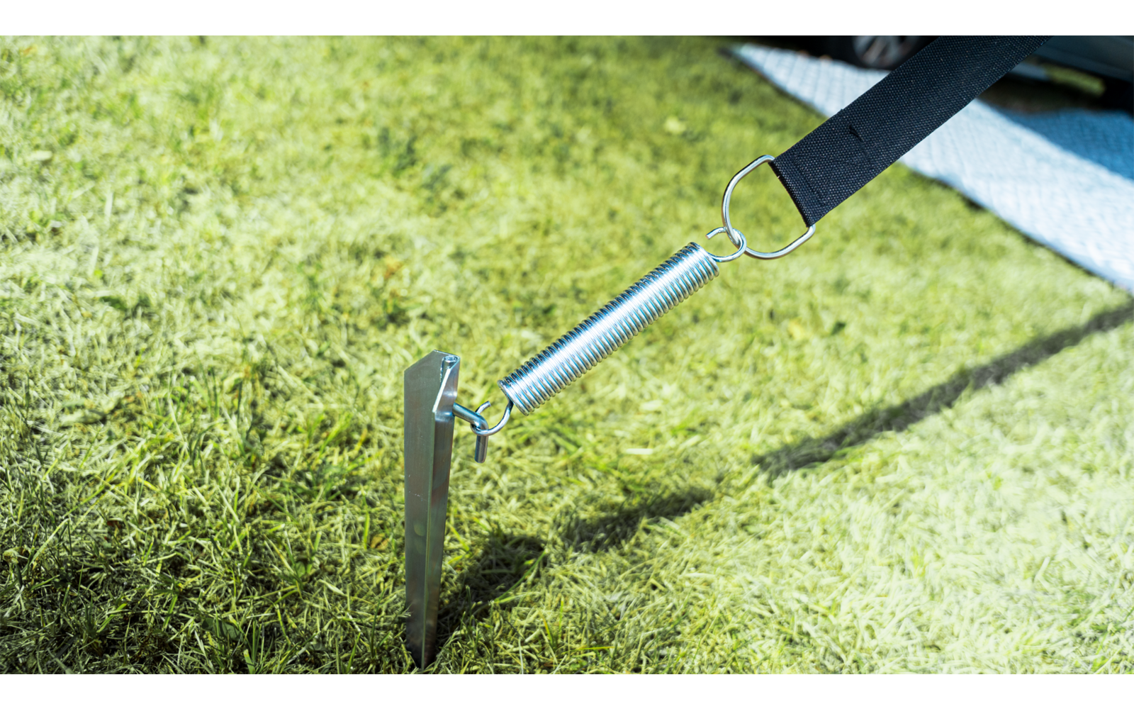 Metal stake driven into dry soil