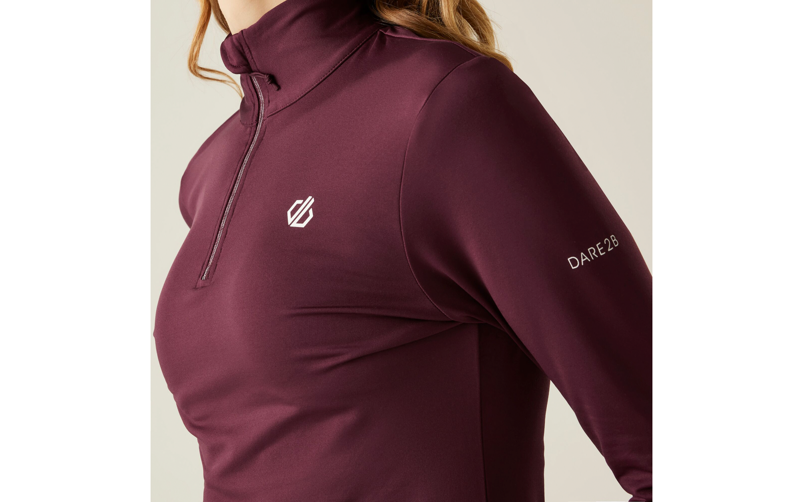 Haut avec fermeture éclair et logo sur la poitrine, couleur bordeaux