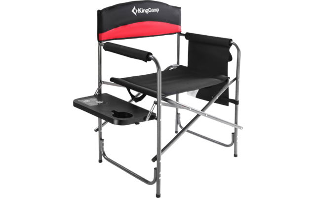 Chaise pliante en métal avec tissu noir et partie dorsale rouge, équipée d'une tablette latérale intégrée et d'accoudoirs