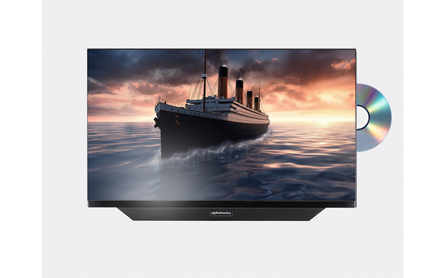 Flachbildfernseher zeigt ein großes Dampfschiff auf ruhiger See unter orangefarbenem Himmel; rechts ist eine teilweise eingesetzte glänzende Disc