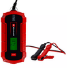 Rood-zwart apparaat met digitaal scherm waarop '13.7 V' staat, twee kabels met rode en zwarte krokodillenklemmen, Einhell-logo aan de voorkant