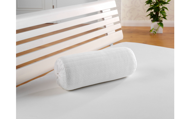 White cylindrical neck roll pillow on a white surface