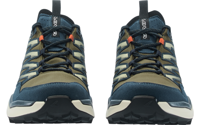 Two blue and olive-green shoes, front view, black laces with orange eyelets, white midsoles and black treaded outsoles