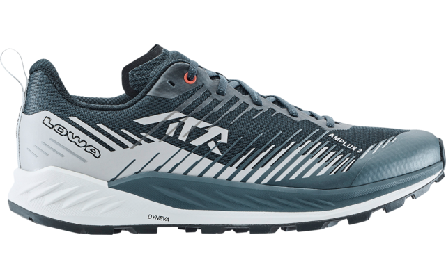 Side view of a gray sports shoe with laces, textured upper, white heel area, treaded sole and 'LOWA' brand marking