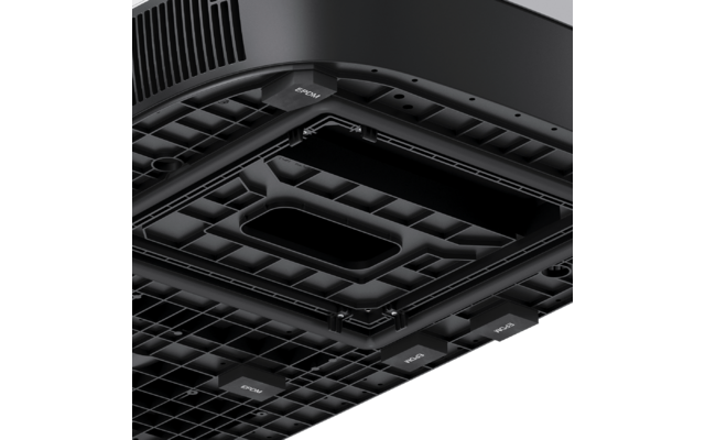 Underside of a black device with a grid pattern, ventilation openings, several rectangular recesses, and small labeled tabs