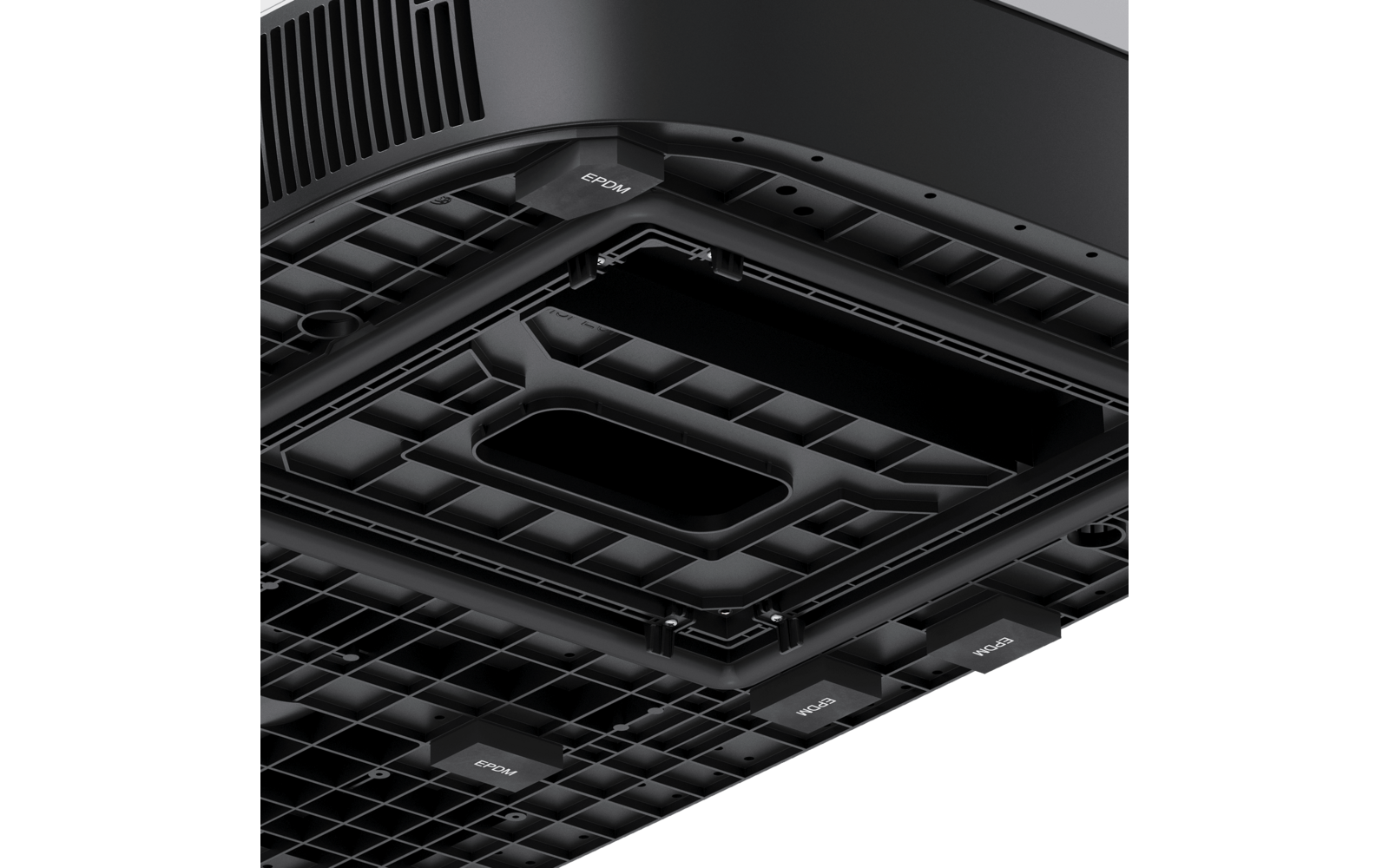 Underside of a black device with a grid pattern, ventilation openings, several rectangular recesses, and small labeled tabs