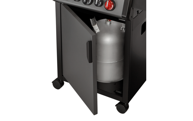 Geöffneter Unterschrank mit einem grauen Gasflaschenbehälter im Inneren