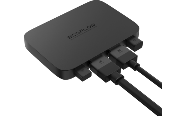 Kleines schwarzes elektronisches Gerät mit mehreren angeschlossenen Kabeln