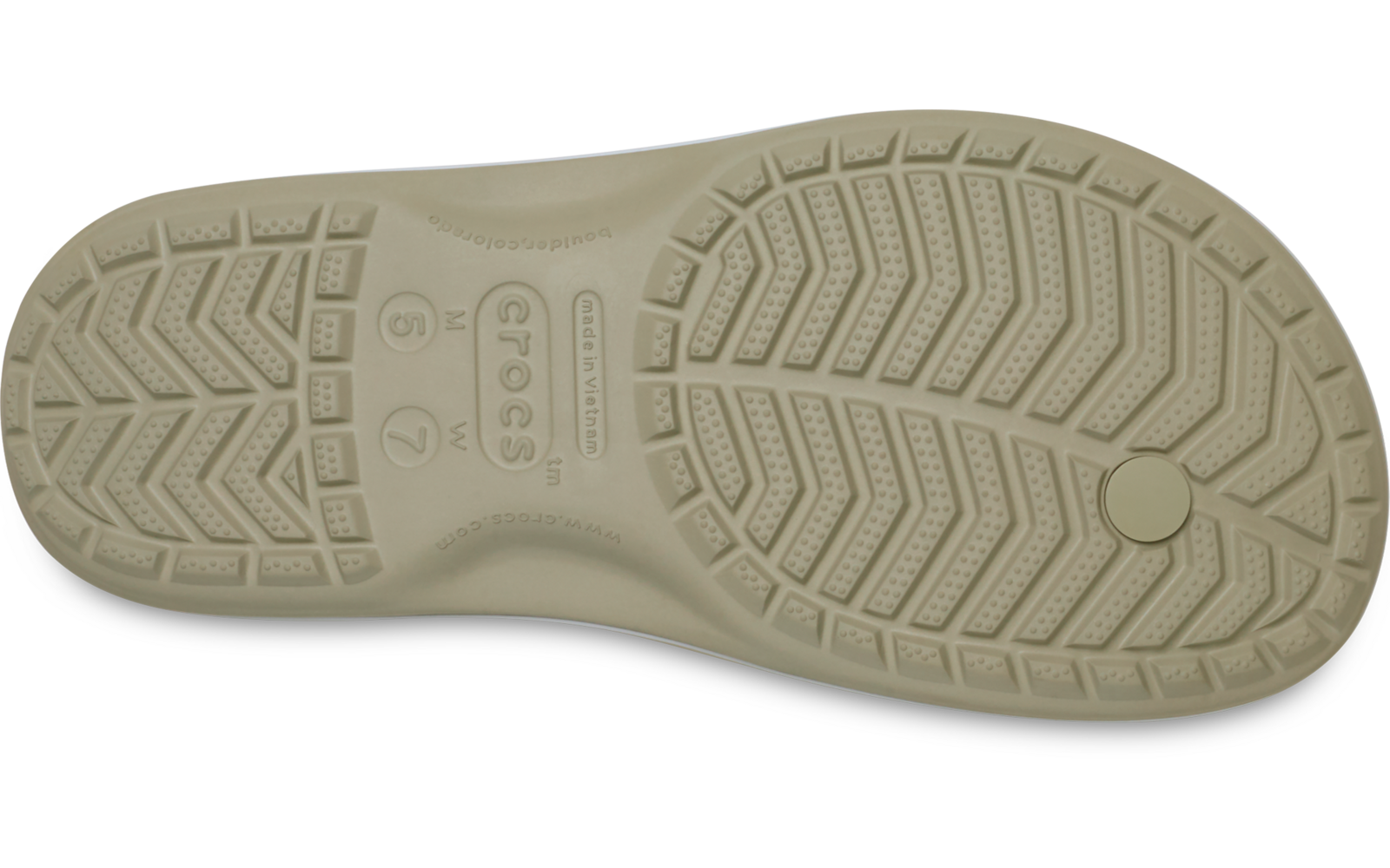 Hellbeige Schuhsohle von unten, profiliertes Sohlenmuster mit Rillen und runder Einprägung