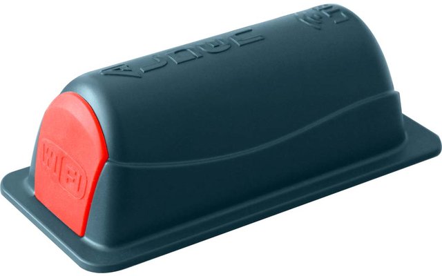 Dunkelgrün-blaues rechteckiges Kunststoffgehäuse mit abgerundeter Oberseite, roter abgerundeter Stirnseite mit Prägung, eingeprägte Schrift auf der Oberseite, flacher rechteckiger Sockel
