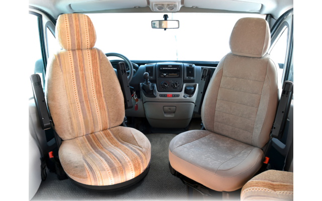 Interior of a vehicle with two padded front seats and steering wheel in the center