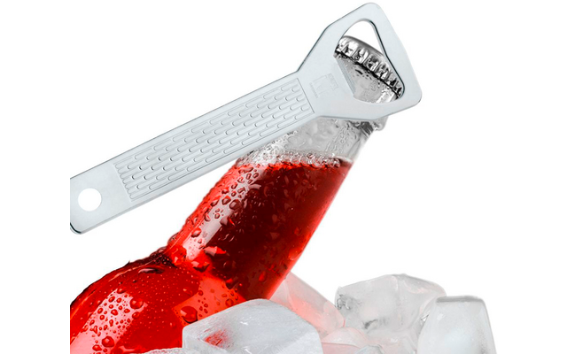 Red glass bottle with condensation, bottle opener on the cap, ice cubes around the bottle