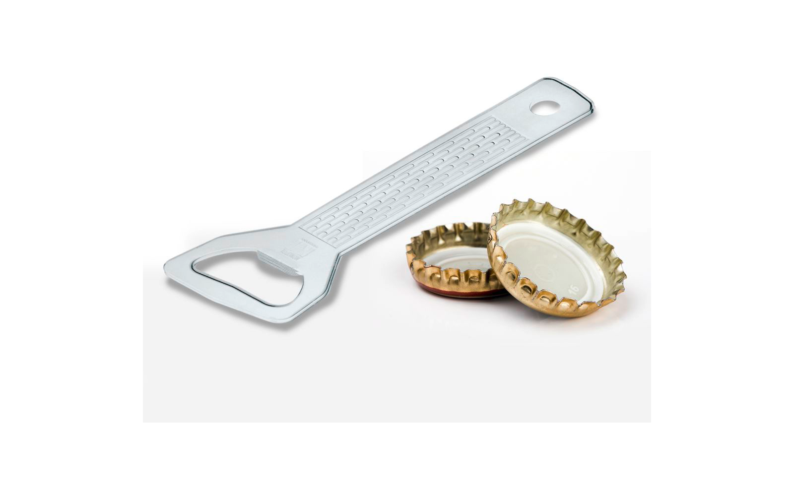 Metal bottle opener with textured handle and two gold bottle caps, one upside down showing white lining, on a white background