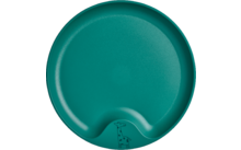 Assiette ronde verte avec deux creux sur le bord