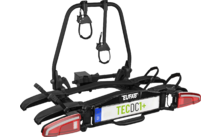 Schwarzer Heckfahrradträger mit integrierten Rücklichtern und montiertem Kennzeichen