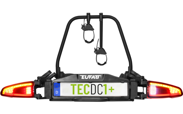Schwarzer Metallrahmen mit zwei roten Rückleuchten, weiße Kennzeichenplatte mit grünem Schriftzug "TECDC1+" und blauem "D"-Feld, Schriftzug "EUFAB" oberhalb, zwei hängende Riemen mit Ringen