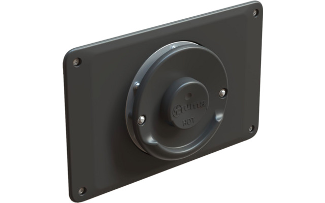 Placa de montaje rectangular gris oscuro con esquinas redondeadas y cuatro tornillos; en el centro una cubierta circular saliente con tres tornillos y la inscripción 'Truma HOT'