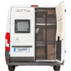 Achteraanzicht van een witte camperbus, rechter achterdeur open, linker deur gesloten met raam; opschrift 'GiottiVan' en Citroën-logo op de deur; muskietennet voor het interieur met planken zichtbaar; kenteken 'HINDERMANN' zichtbaar
