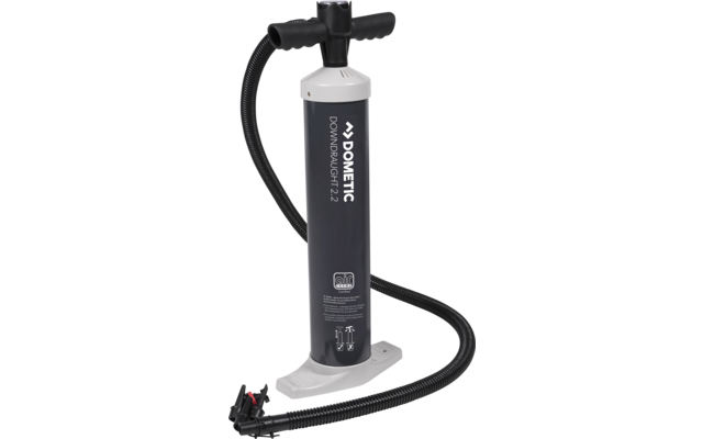 A black hand pump with a hose and pressure gauge