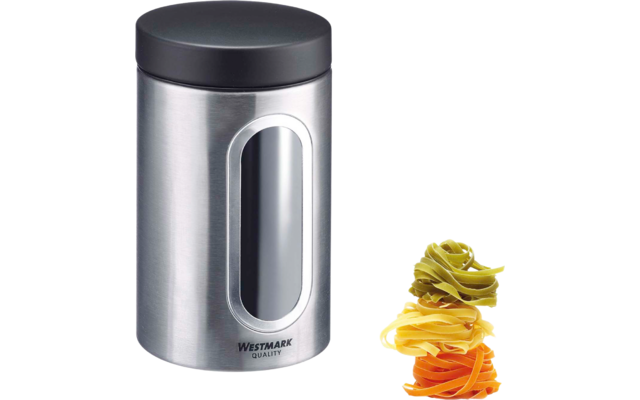 Boîte de rangement en acier inoxydable avec couvercle noir et fenêtre ovale, à côté trois nids de pâtes colorés (vert, jaune, orange)