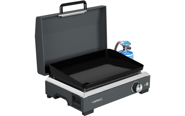 Open gray carrying case with a black rectangular griddle on a silver-gray gas unit; control knob at front right, small blue gas canister with hose at back right