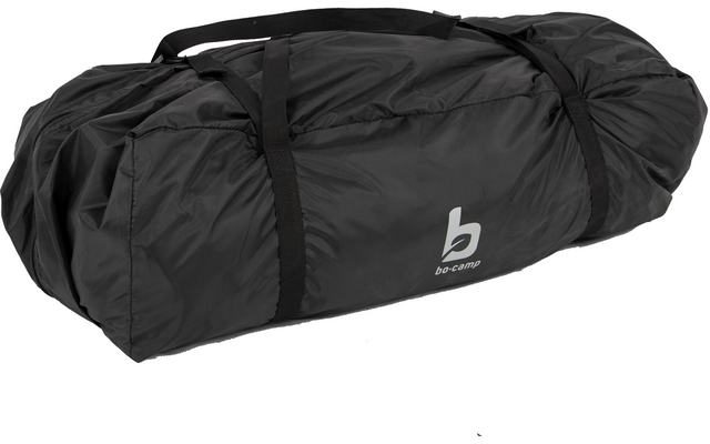 Black rolled-up nylon duffel bag with black carrying straps and white 'b' logo on white background