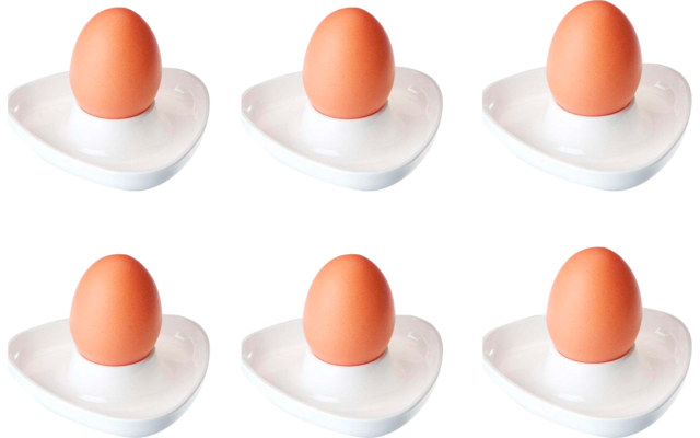 Six brown eggs in white egg cups, arranged in two rows of three on a white background