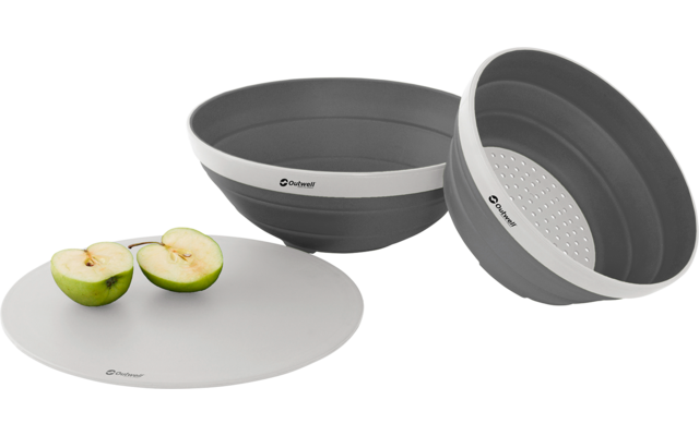 Zwei graue Schüsseln, eine mit Deckel, daneben zwei halbierte grüne Äpfel