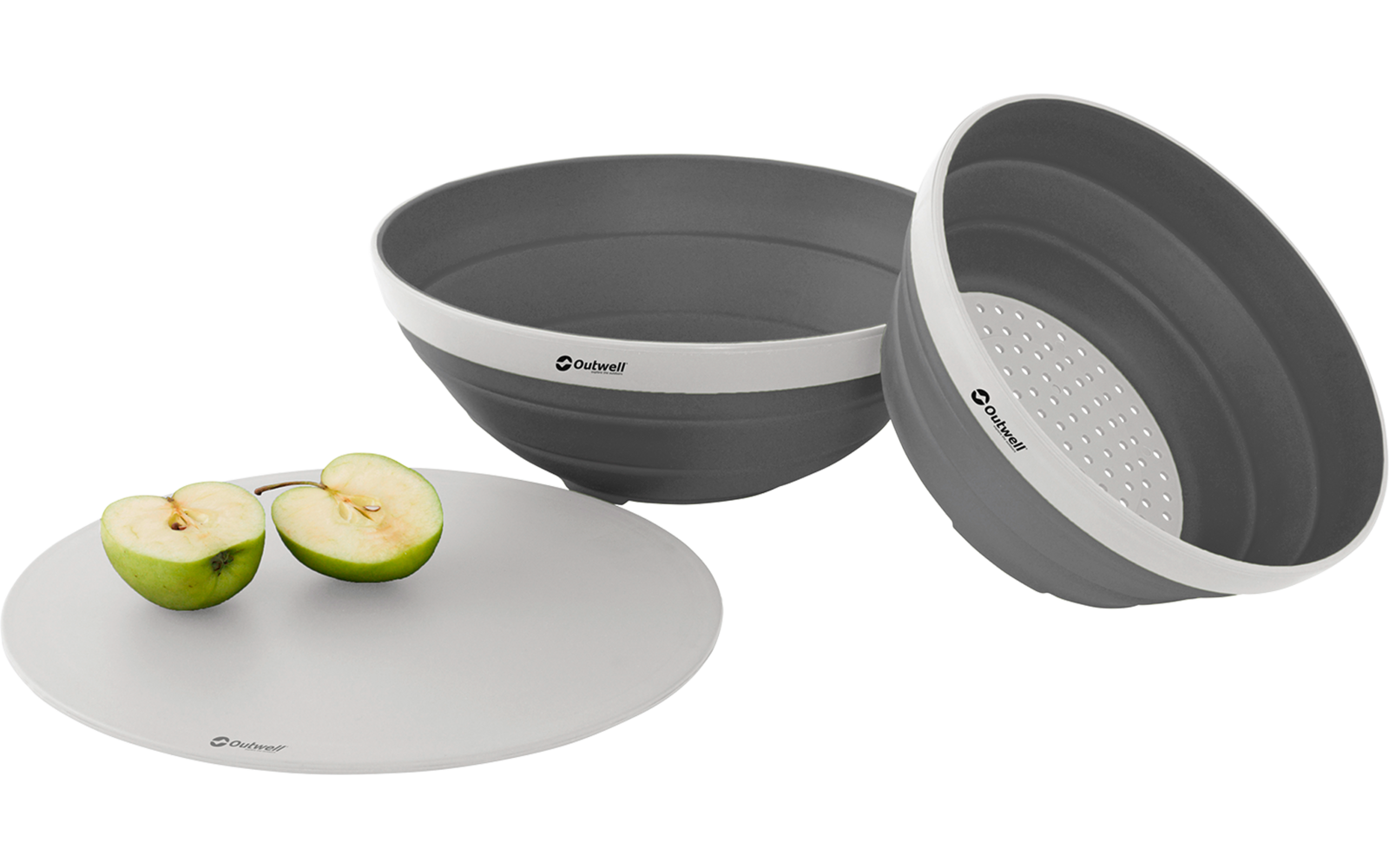 Zwei graue Schüsseln, eine mit Deckel, daneben zwei halbierte grüne Äpfel