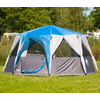 Blue and gray tent on green grass in sunny weather