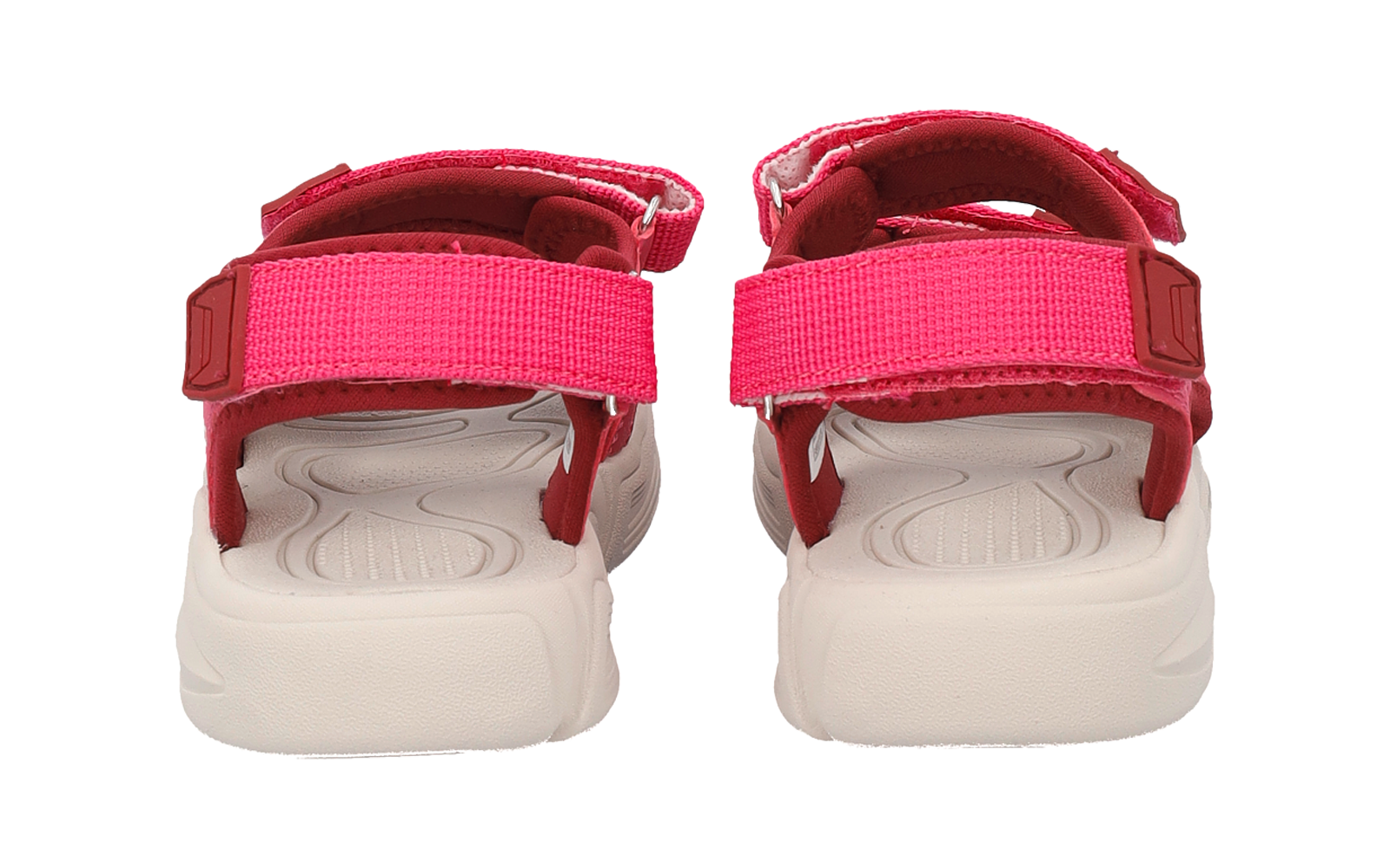 Rear view of a pair of pink sandals with Velcro straps and white soles on a white background
