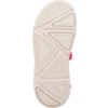 Bottom of a light beige shoe sole with geometric tread patterns and a pink strap visible at the side