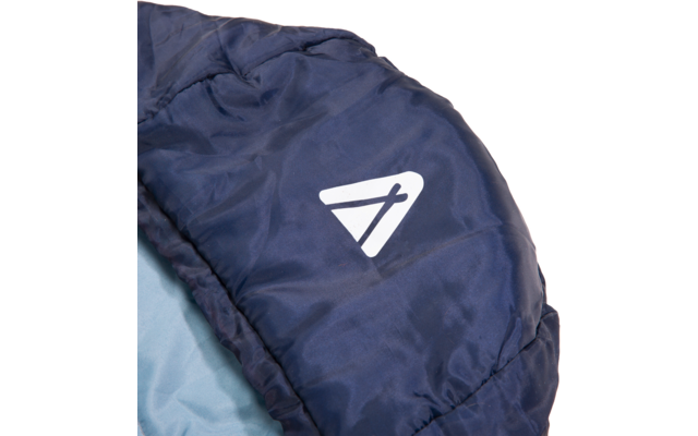Close-up of dark blue quilted fabric with a light blue lining and a white triangular print with a diagonal line