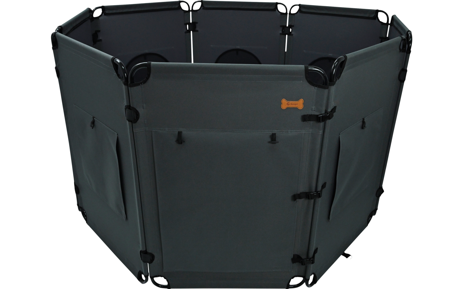 Hexagonal dark gray fabric structure with six connected panels; front panel with a door and buckles; side panels with pockets; small orange bone-shaped patch on the front