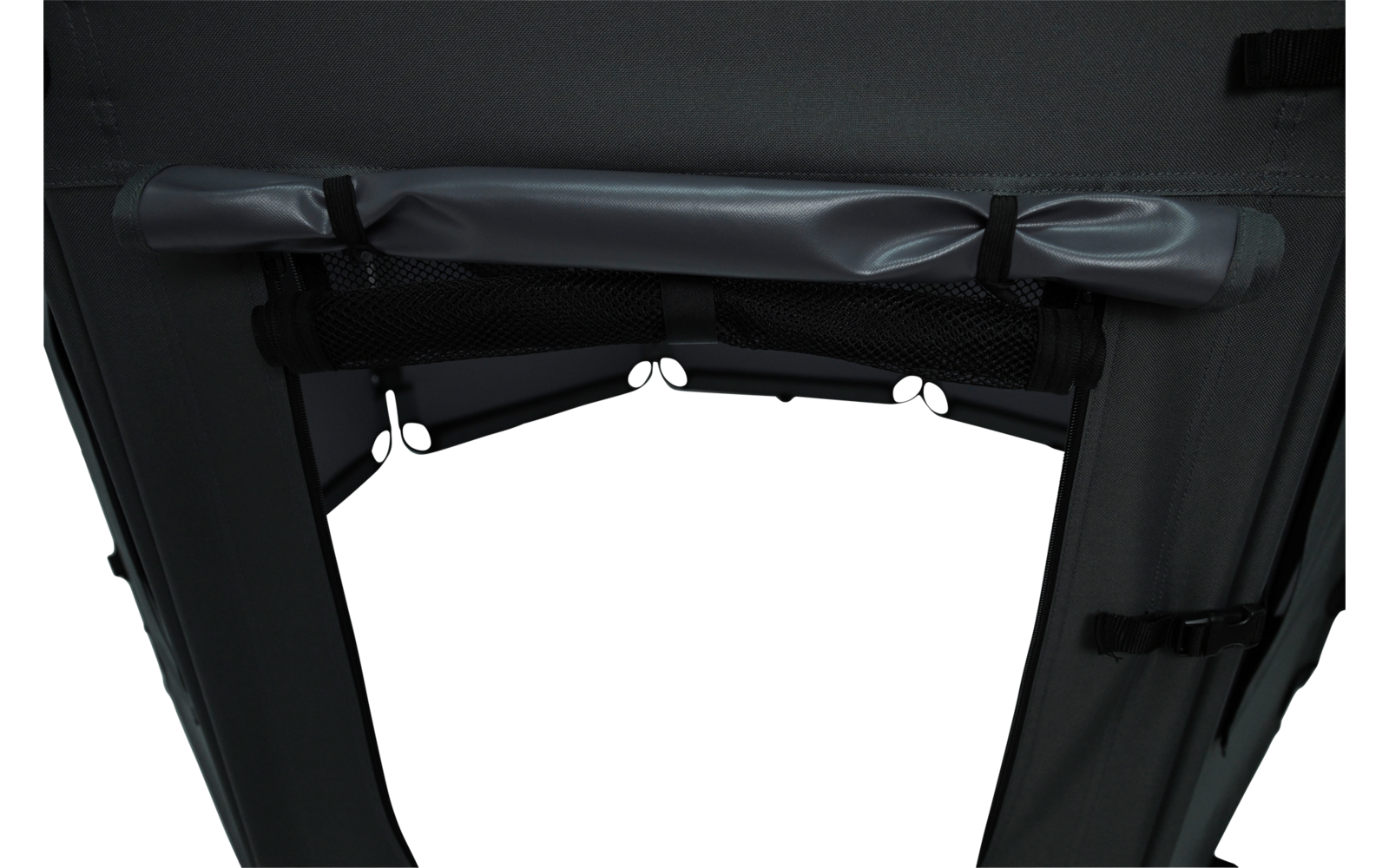 Dark gray fabric panel with a rolled-up strap at the top secured by two black clips, a mesh pocket below, side straps with buckles, and a central opening