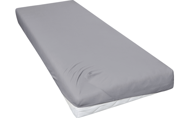Matras met grijs hoeslaken, witte matrasrand zichtbaar bij de hoek, lichte kreukels